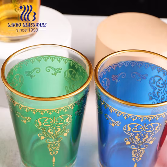 Venta al por mayor Regalo de gama alta Estilo de Marruecos Francia Pulverización personalizada Vidrio rojo Agua Té Taza para beber Vaso con diseño dorado árabe para uso doméstico
